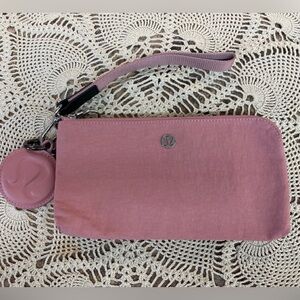 Lululemon Now and Always Pouch, a versatile wristlet with lululemon CHARM.
